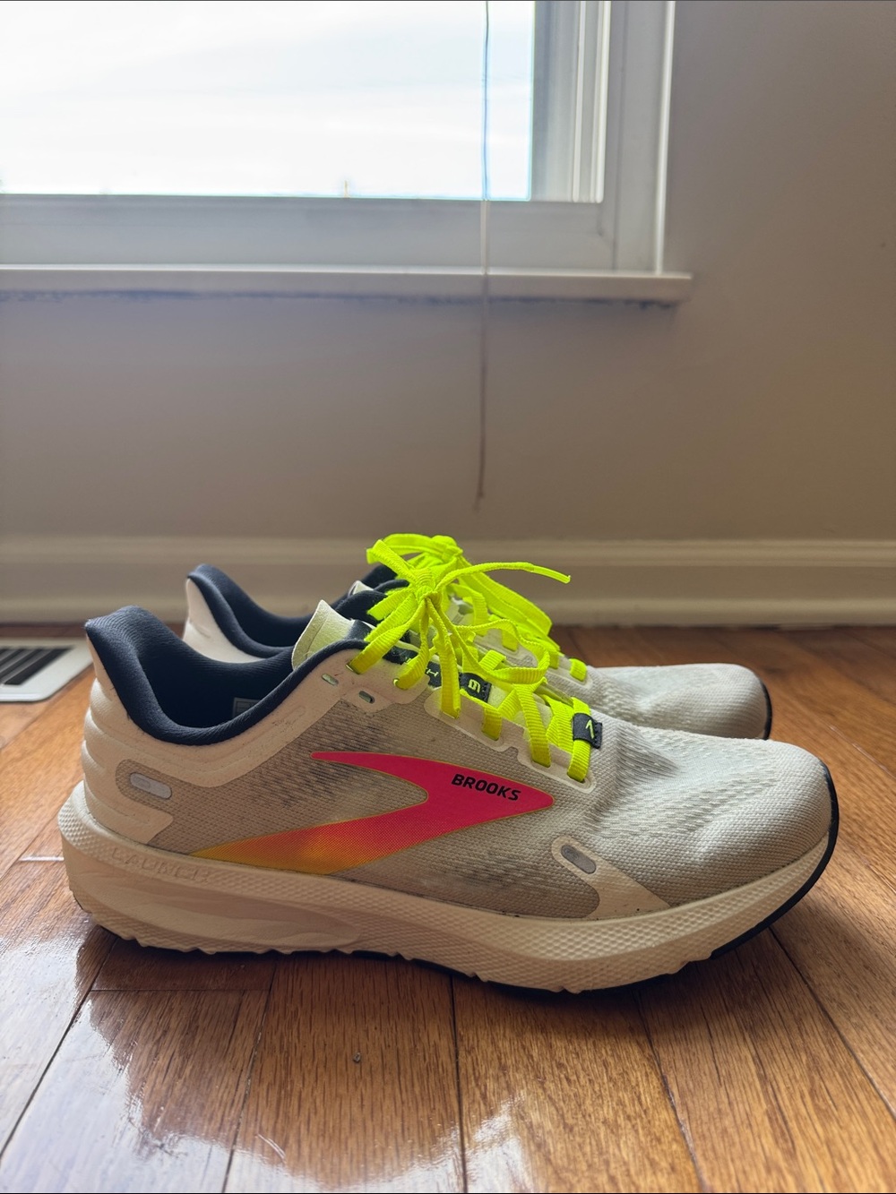 Brooks Cream Running Shoes with Neon Yellow Laces and Pink-Orange Logo